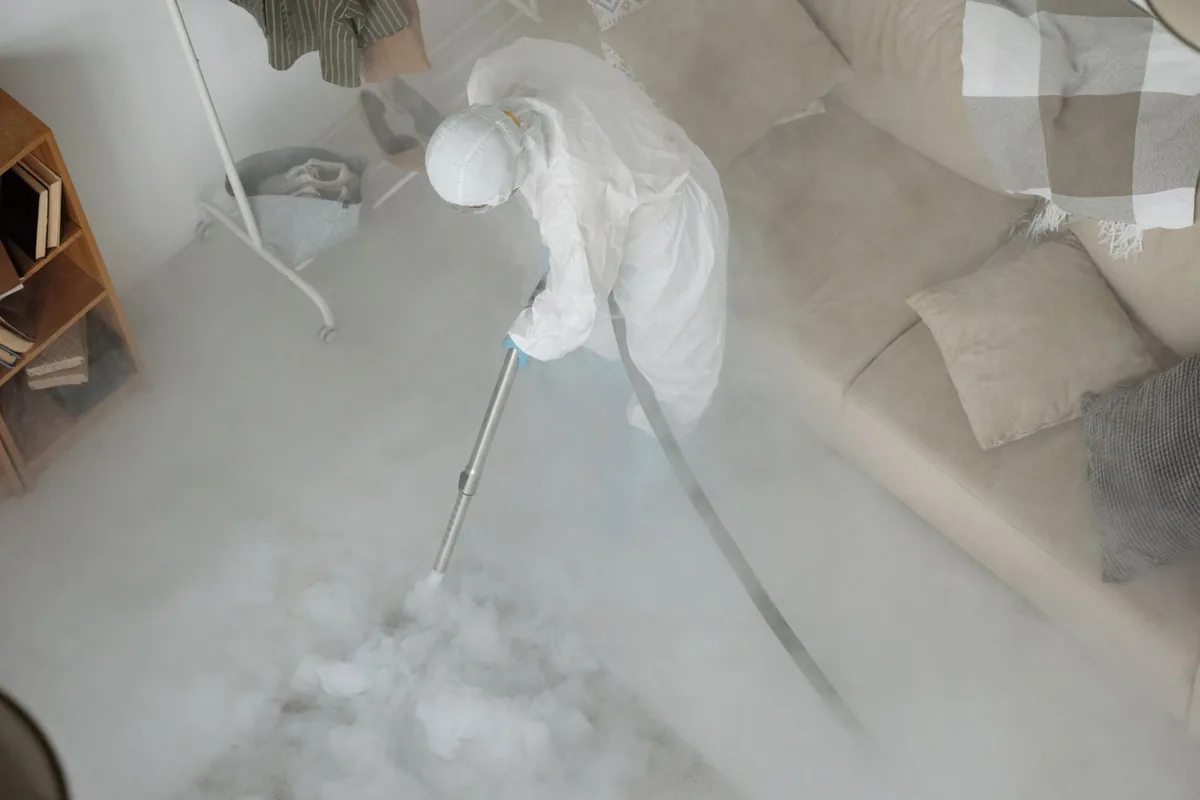 Biohazard cleanup technician in protective equipment, Highland Park, Pittsburgh, PA